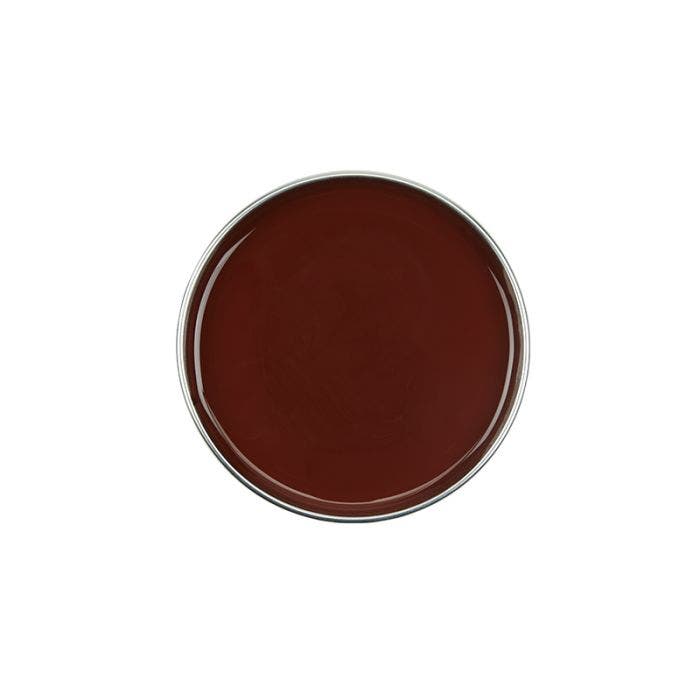 Top view of a can of GiGi Milk Chocolate Infused Creme Wax without lid showing its rich, brown wax contents  