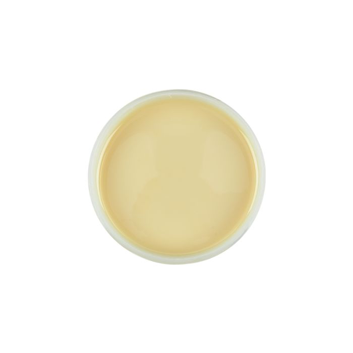 Top view of an open container of Satin Smooth beBare Hair Removal System Soy Wax featuring its creamy beige color